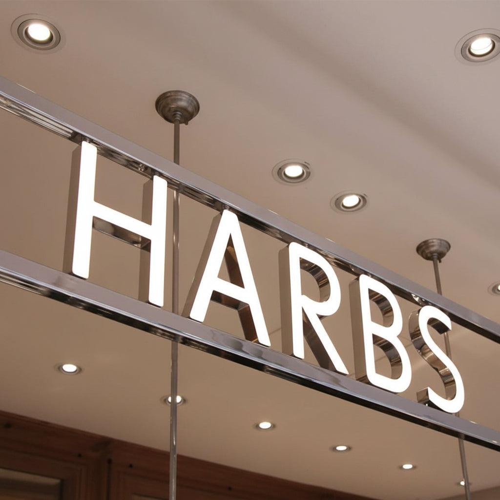Luxury Harrods logo wall art canvas featuring an illuminated retail brand-inspired design in a modern minimalist style.