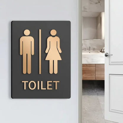 Custom men and women restroom neon sign with bold toilet lettering for modern interiors.