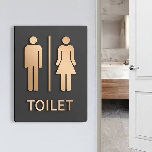 Custom men and women restroom neon sign with bold toilet lettering for modern interiors.