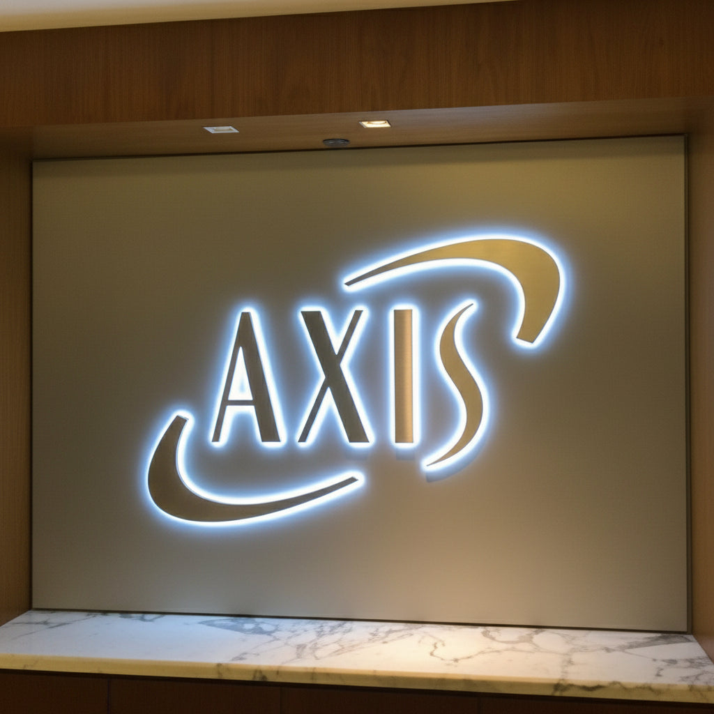 Custom Axis LED acrylic logo sign with cool white backlit illumination mounted on a modern office reception wall.