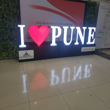Personalized LED city entrance sign with glowing heart icon for tourism branding