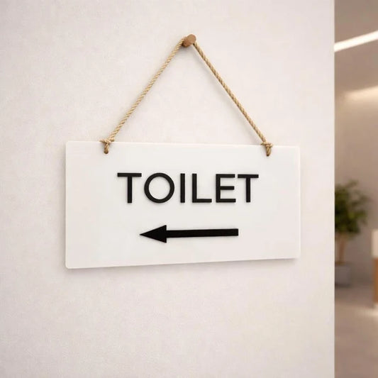 Modern toilet wayfinding neon sign with left-pointing arrow for offices, hotels, and public spaces.