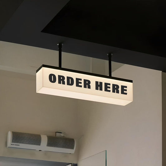 Illuminated ceiling suspended Order Here sign for modern food service business