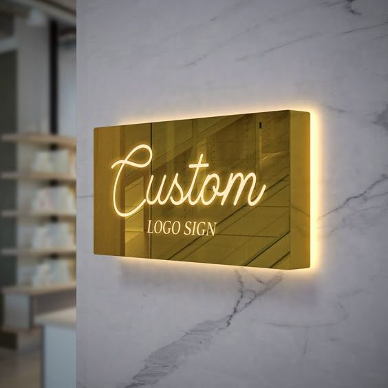 Luxury metallic business logo display mounted on wall with LED backlit glow
