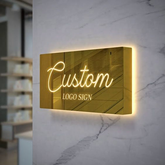 Luxury metallic business logo display mounted on wall with LED backlit glow