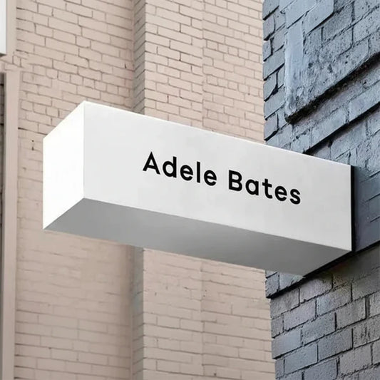 Modern outdoor LED projecting sign featuring illuminated white cabinet and custom business name