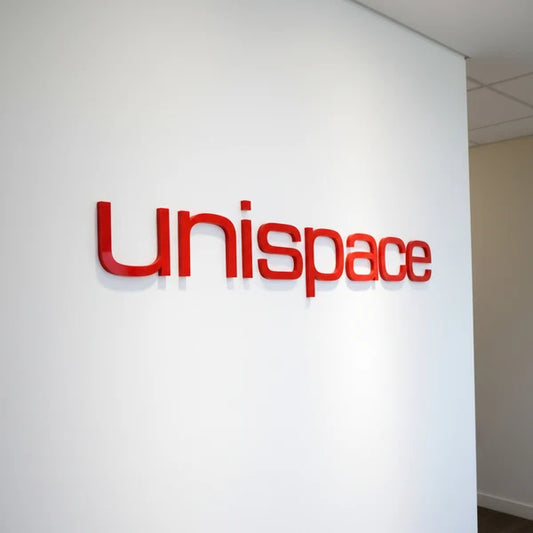 Modern acrylic letter signage for office branding and commercial interior display.