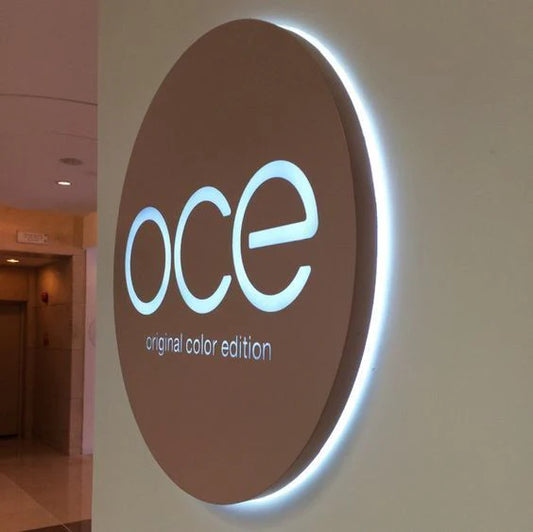 Circular backlit acrylic business sign featuring elegant halo lighting for corporate branding.