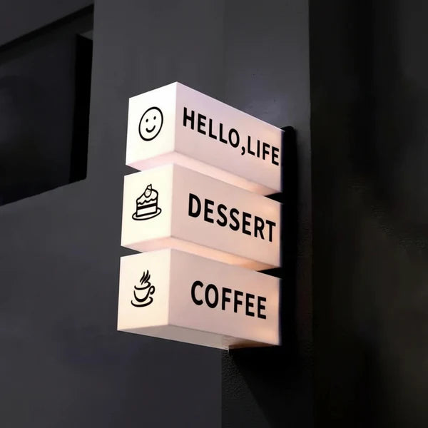 Modern multi-panel acrylic LED business sign mounted on a wall for café and retail navigation.