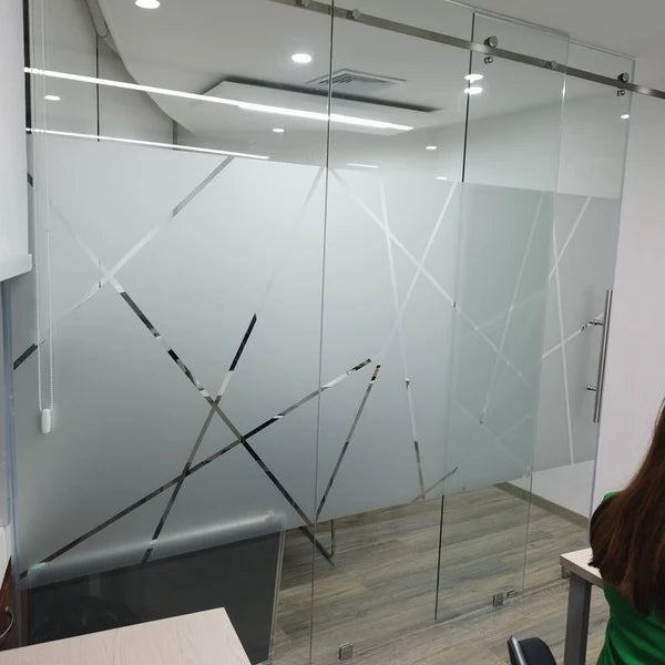 Custom frosted privacy film installed on office glass doors and conference room walls
