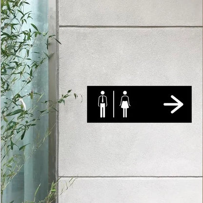 Modern custom restroom wayfinding neon sign for commercial interiors.