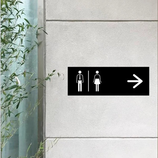 Modern custom restroom wayfinding neon sign for commercial interiors.