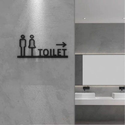 Custom restroom wayfinding neon sign with toilet text and directional arrow for commercial interiors.