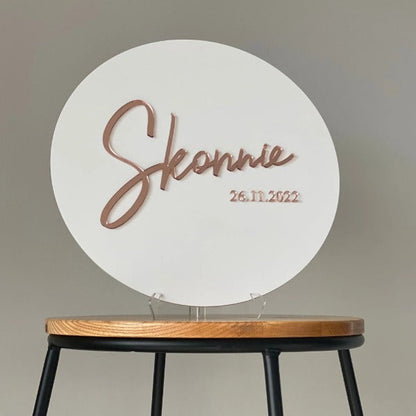 Elegant white circular welcome sign featuring custom event name and date display