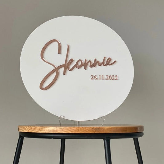 Elegant white circular welcome sign featuring custom event name and date display