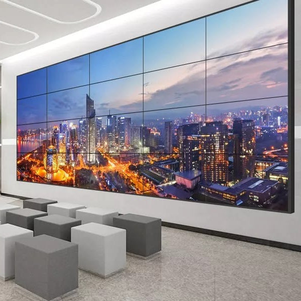 large indoor LED video wall multi panel display showing cityscape high resolution